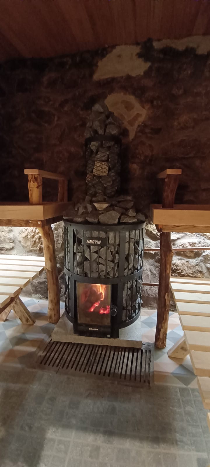 Cedar benches with stone walls and live-edge backrest